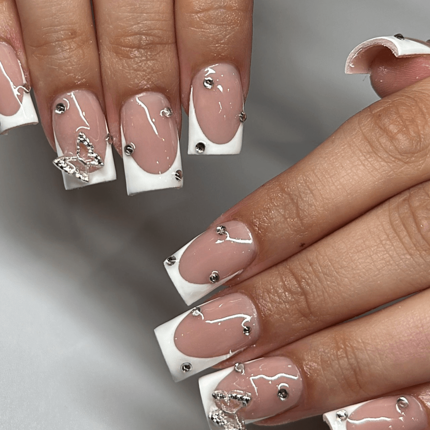 White Manicure With Rhinestone Accents