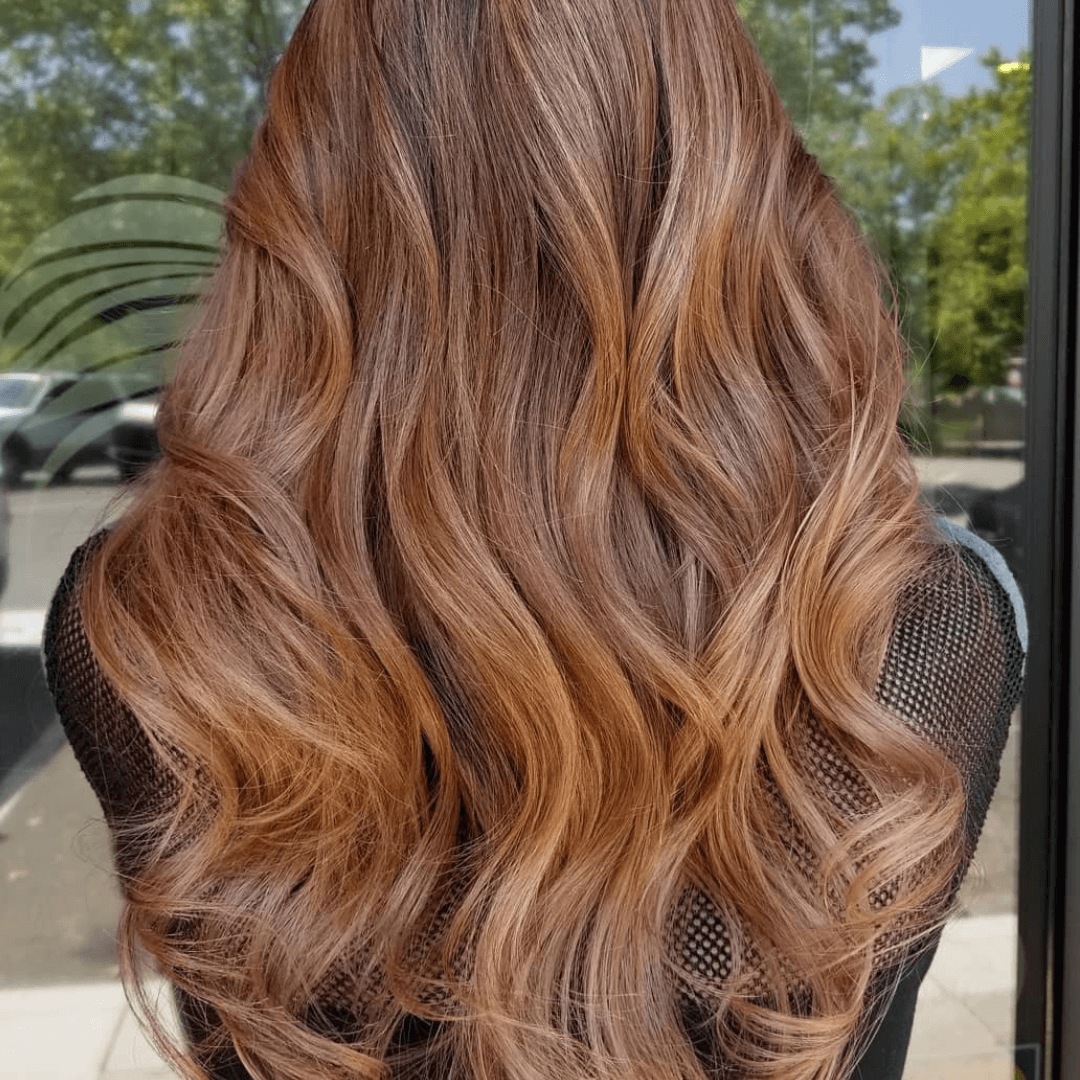 Light brown hair with copper highlights