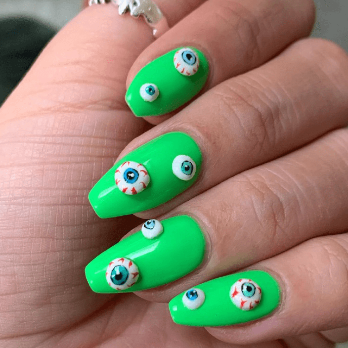 Green Halloween Nails with Creepy Eyes