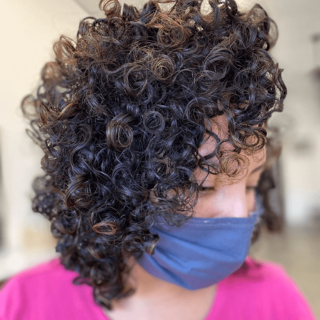Cropped, fluffy curls with bangs 