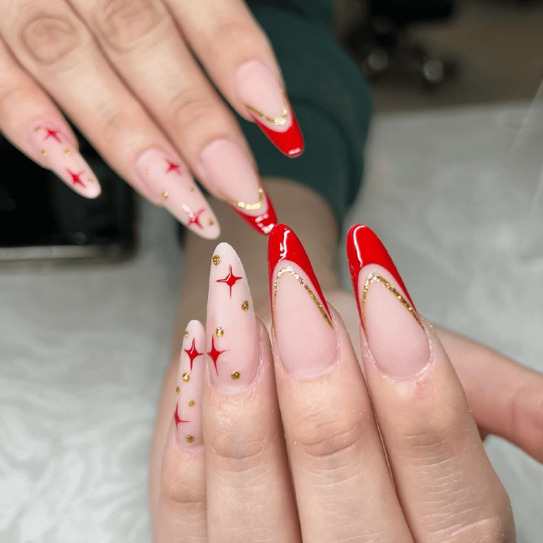 Red nails with a gold stripe 