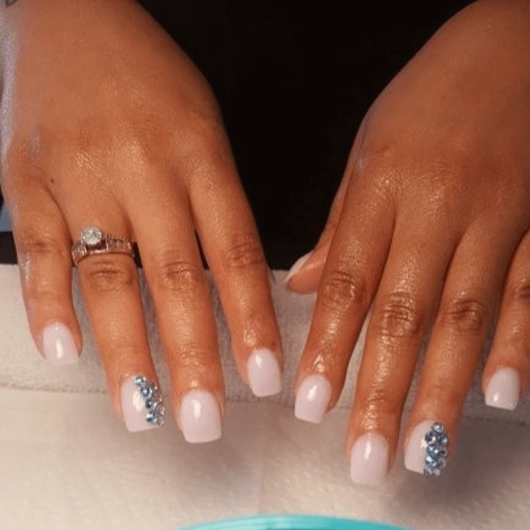 White Manicure With Rhinestone Accents